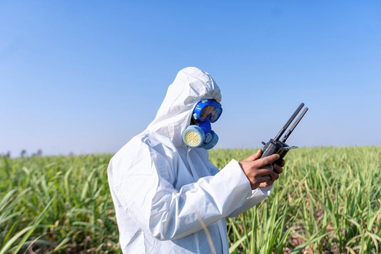 Receive assistance with Food Fumigation from The Fumigation Company image shows person taking reading in field